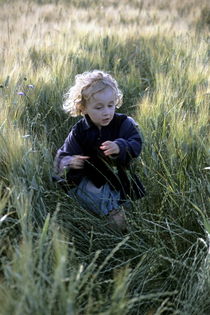 Girl running in wheat field by Sami Sarkis Photography