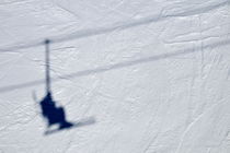 Shadow of skier on ski lift by Sami Sarkis Photography