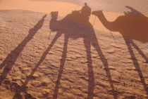 Men and camels shadows on sand dune by Sami Sarkis Photography
