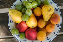 Variety of fresh summer fruit on a plate. by Sami Sarkis Photography