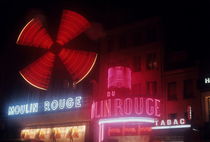 Illuminated neon signs of the Moulin Rouge by Sami Sarkis Photography
