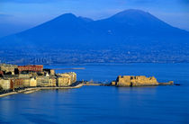 View across the Bay of Naples showing the Aragonese Castle on the peninsula of Ischia with the townscape and Mount Vesuvius in the background by Sami Sarkis Photography