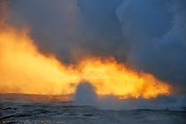 Steam rising off lava flowing into ocean at sunset by Sami Sarkis Photography