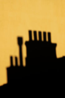 Chimneys silhouetted against the evening sky by Sami Sarkis Photography