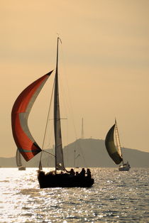 Sailboats at sunset navigating around Frioul Islands by Sami Sarkis Photography