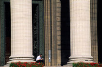 Man reading a book beside the columns of La Madeleine church by Sami Sarkis Photography