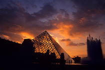 Silhouetted glass pyramid and buildings of the Musée du Louvre by Sami Sarkis Photography