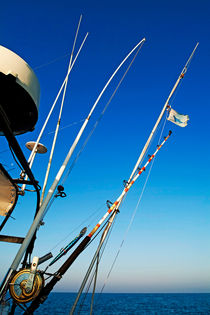 Fishing rods onboard a boat in the Mediterranean Sea by Sami Sarkis Photography