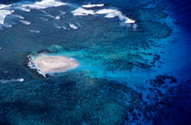 Sandy island surrounded by tropical seas in the Pacific Ocean. by Sami Sarkis Photography