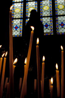 Candles burning inside the Basilica of the Saint Sauveur by Sami Sarkis Photography