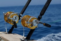Two rod and reels on board a game fishing boat in the Mediterranean Sea by Sami Sarkis Photography