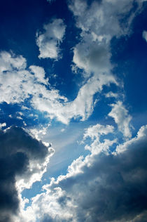 Clouds and sunlight in the sky following a storm by Sami Sarkis Photography