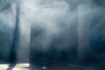 Smoke and sunlight mingle on a street in Trinidad by Sami Sarkis Photography