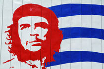 Billboard with the iconic Che Guevara portrait and national Cuban flag by Sami Sarkis Photography