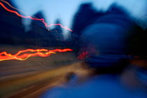 Man driving a motorbike at dusk on a country road among the limestone peaks von Sami Sarkis Photography