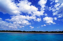 Looking across exquisite blue waters to the beach of Cozumel Island by Sami Sarkis Photography