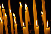 Candles burning in the Auch Cathedral by Sami Sarkis Photography