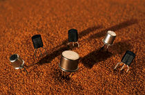 Computer Chips On Red Sand by Sami Sarkis Photography