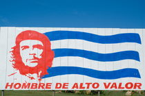 Billboard with the iconic Che Guevara portrait and national Cuban flag by Sami Sarkis Photography