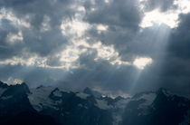 Sunbeams playing over the Barre des Ecrins and La Meije mountains in the French Alps by Sami Sarkis Photography