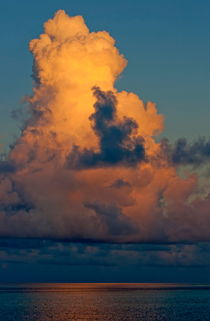 Sunrise in a cloudy sky over the sea by Sami Sarkis Photography