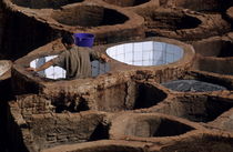 Man working in a tannery by Sami Sarkis Photography