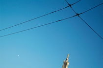 Electrical wires cross in the sky with the tip of Notre Dame de la Garde by Sami Sarkis Photography