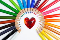 Heartshape and Circle of colorful crayons by Sami Sarkis Photography