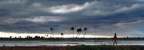 Boy Walking in a Storm Kerala Panorama von serenityphotography