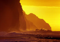 Cliff wave crash, orange sunset, Kauai, USA by Tom Dempsey