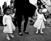 Two African girls holding mum for hands, Israel by yulia-dubovikova