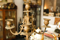 ancient candelabrum in an antique shop by yulia-dubovikova