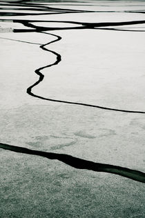 Frozen lake with ice sheets by Lars Hallstrom