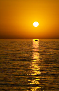 greek island sunset with boat by meirion matthias